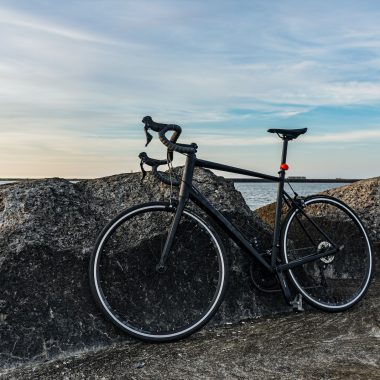 a bicycle parked on a rock