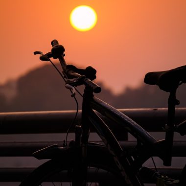 black bicycle during golden hour