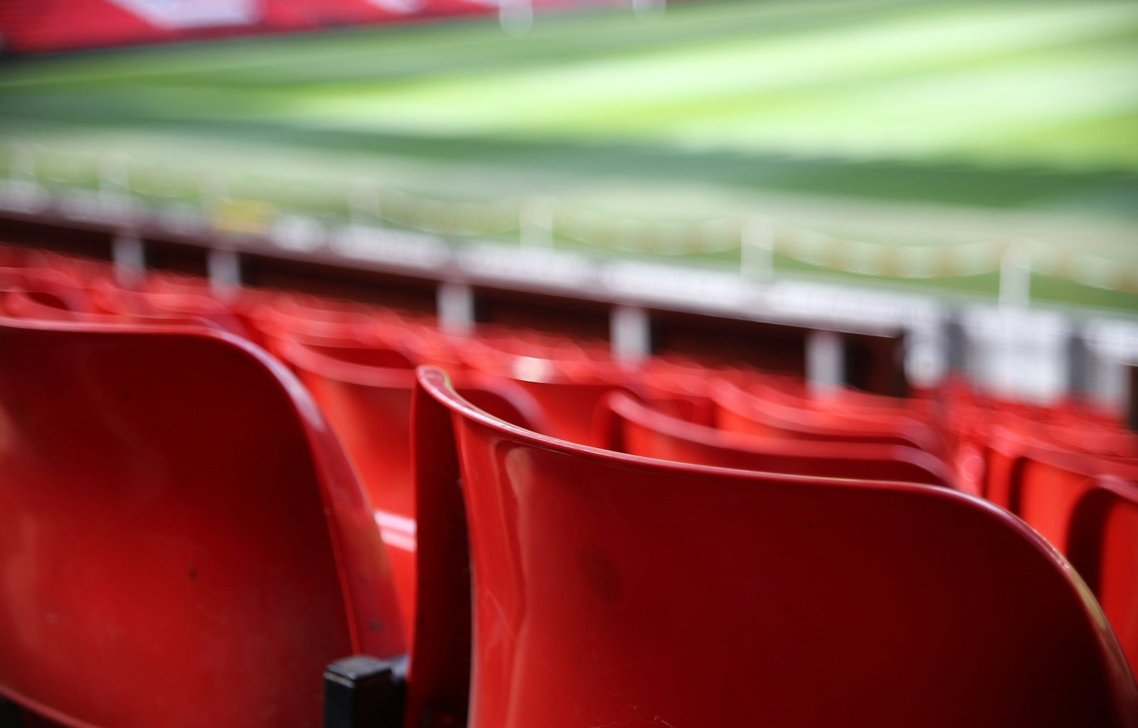 red plastic seats focus photography