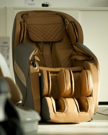 brown and black backpack on white table