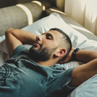 man lying on bed