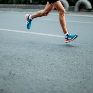 pair of blue-and-white Adidas running shoes