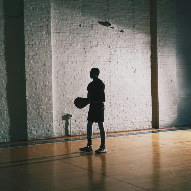 man holding basketball