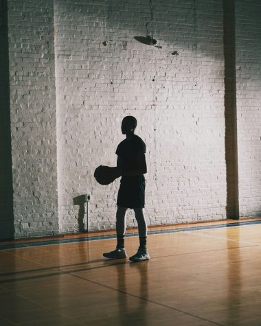 man holding basketball